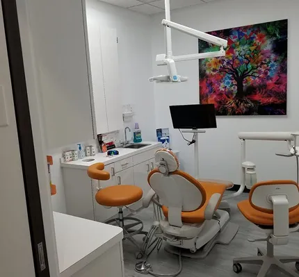 Treatment room with orange chairs at our Cedar Park dental office