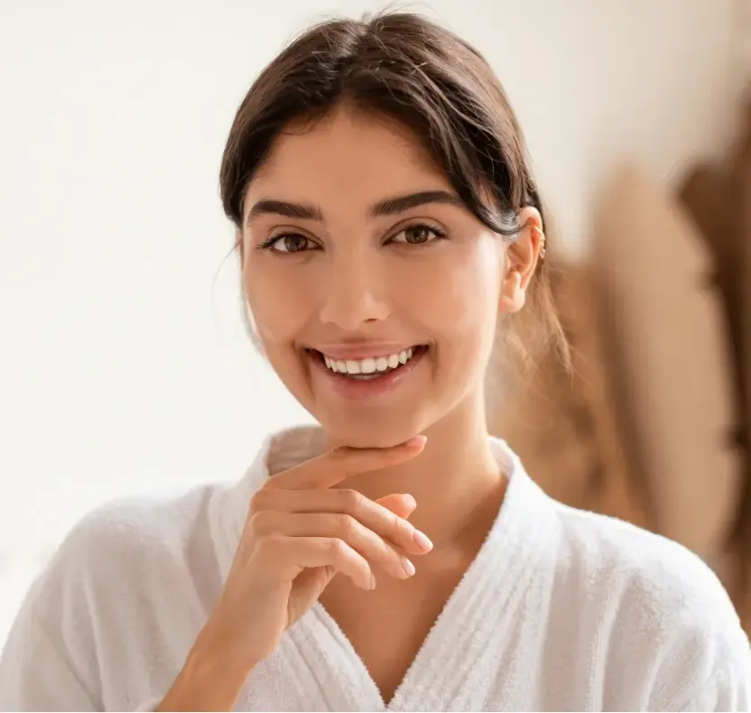Smiling woman with a bright, white smile after professional teeth whitening in Cedar Park